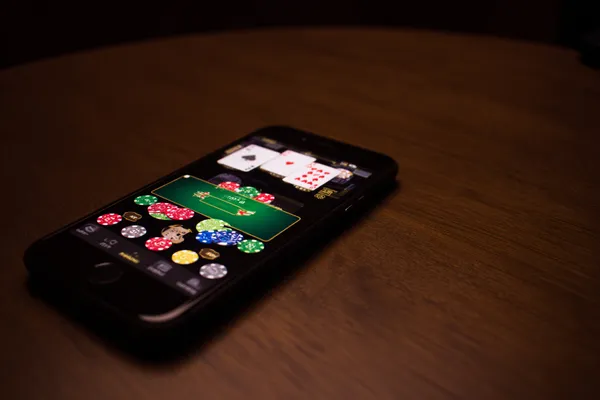 777ZK Login — Instantly access your secure account A confident dealer surrounded by casino chips inviting players to access their 777ZK account, reflecting quick and easy login options.